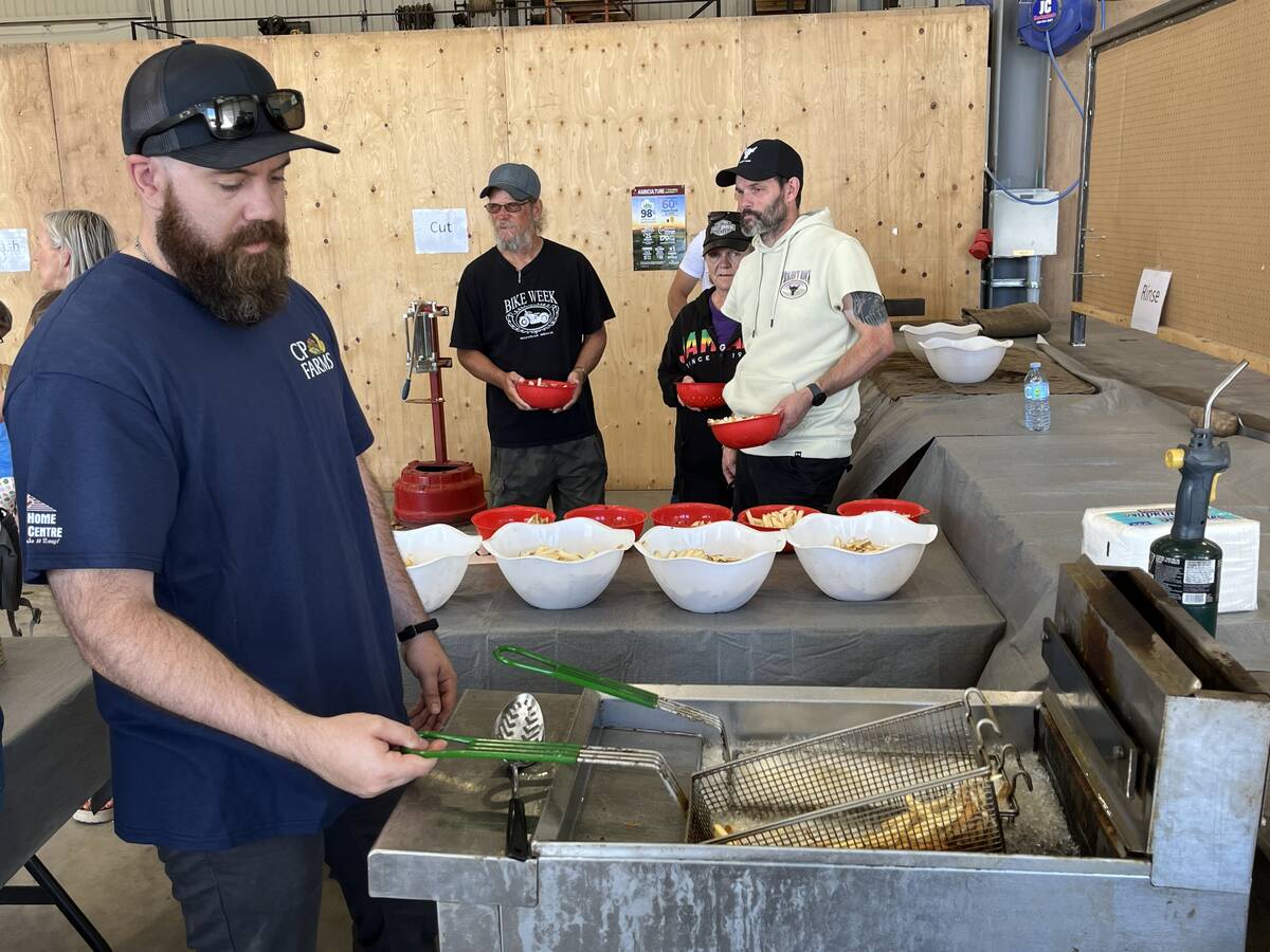 McCains representatives frying up some potatoes at Open Farms Days in Alberta at CP Farms