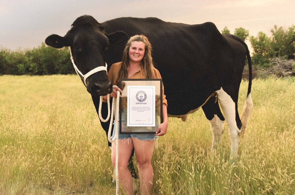 Jasmine Entz with her steer, Beef, who holds the Guinness Book of World Records title of tallest steer. Photo: Submitted