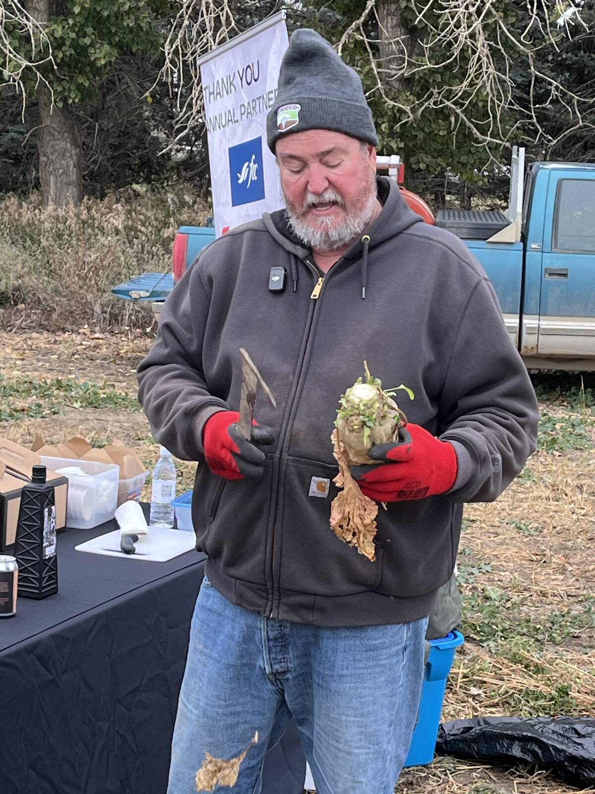 Alberta Sugar Beet Growers president Gary Tokariuk gives visitors a first-hand look at a sugar beet pulled from his farm during a field tour in mid-October. Photos: Greg Price
