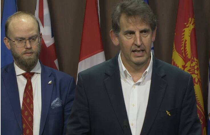 Peter Awram, director of the Canadian Beekeeping Federation, speaks to an Ottawa press gallery about Canadian beekeeper challenges Nov. 25. Arnold Viersen, the Alberta MP for Peace River – Westlock who introduced a motion to Parliament about what the sector needs — is pictured left. Photo: Screen capture