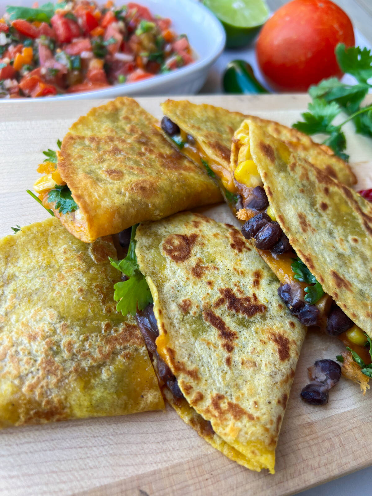 Replace the black beans and corn in these quesadillas with any leftover meat and veggies. 
Photo: Getty Stewart