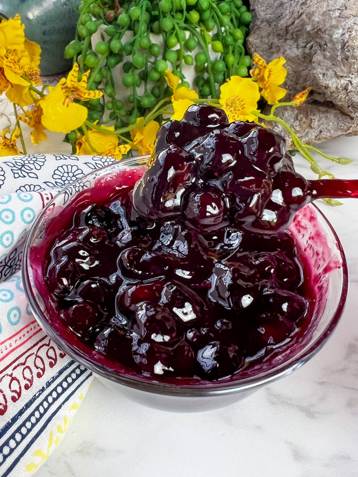 A quick and easy fruit sauce perfect for topping pancakes, yogurt or ice cream. This is a blueberry lime sauce. Photo: Getty Stewart