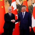 Canadian Prime Minister Mark Carney shakes hands with President of China Xi Jinping at the Great Hall of the People in Beijing, China on Friday, Jan. 16, 2026. Sean Kilpatrick/Pool via REUTERS
