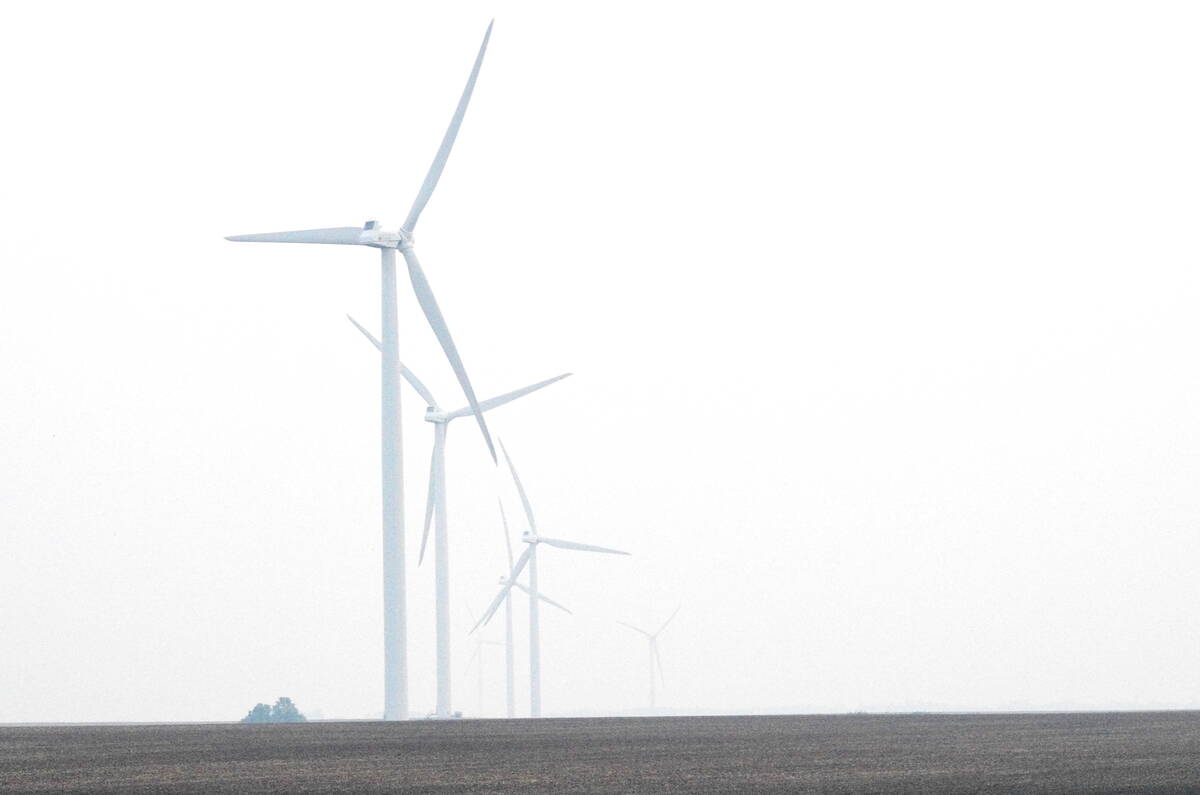 Windmills disappear into the thick wildfire smoke that blanetted southern Manitoba June 9, 2025. Thick smoke was one big weather-related story of the year. Photo: Alexis Stockford
