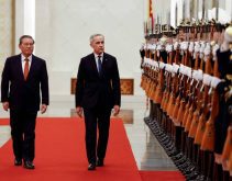 Prime Minister Mark Carney and China's Premier Li Qiang review an honour guard in Beijing on Jan. 15, 2026. Agreements to improve trade in Canadian canola, beef and pulses have followed from Carney's meetings in China. Photo: Reuters/Carlos Osorio
