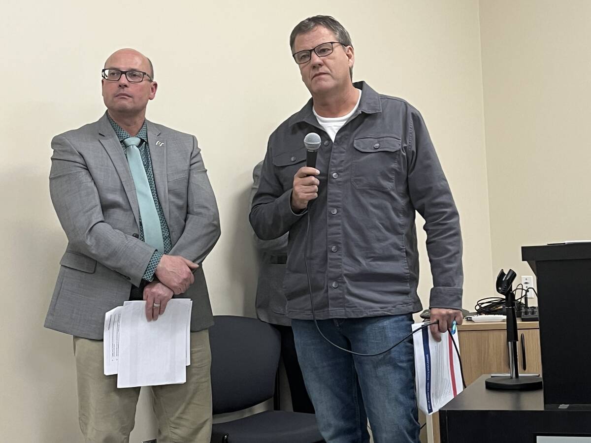 Bryce Surina (left), director of community services fro the M.D. of Taber, and Brian Peers, manager of lands, planning and development were on hand to answer questions by municipal resdients on proposed land management strategy involving various grazing/cultivated leases and land sale policy to a packed house at the municipality’s operations building in early February. The information and feedback session will be used for consideration as the policies will come to the floor once again at a Feb. 24 council meeting, with some grazing leases expiring at the end of the month in the long-contested issue. Photo: Greg Price