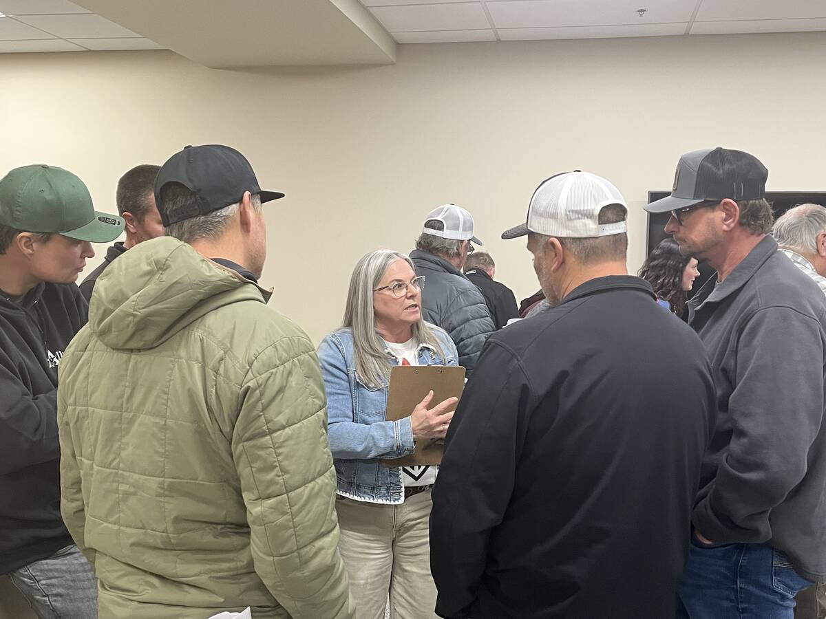 M.D. of Taber Reeve Tamara Miyanaga answers questions of a handful of concerned producers and ratepayers after a public information/feedback session on Feb. 10 for the municipality’s proposed land management strategy when it comes to grazing and cultivated leases on lands it possesses for agricultural use. Photo: Greg Price