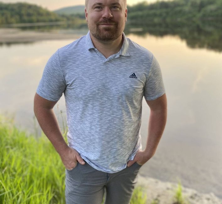 Quebec farmer Maxime Leduc standing in front of a river. Photo: Lilian Schaer