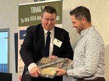 Gary Tokariuk (left) receives some gifts of appreciation for his six years of service as president of the Alberta Sugar Beet Growers, as he handed the reins over to Darren Klemen (right) at the organization&rsquo;s AGM on Mar. 4 in Lethbridge, Alta.