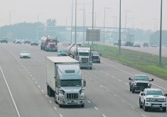 trucks driving on a hazy highway photo: file