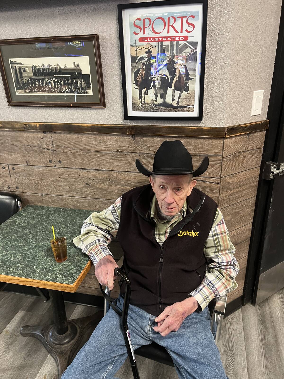 VanCleave stops off at the Royal Hotel to enjoy a drink with family and friends as he sits under a print of the front cover of a 1954 issue of Sports illustrated on which he is pictured. Photos: Greg Price