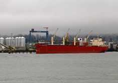 Cargo ship in English Bay approaching Port of Vancouver grain terminals that depend on Second Narrows rail bridge for grain deliveries.