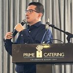 Javier Bahamon, Alberta Pork's quality assurance and production manager, speaks at a podium during a producer meeting in Lethbridge, Alta. Photo: Greg Price.