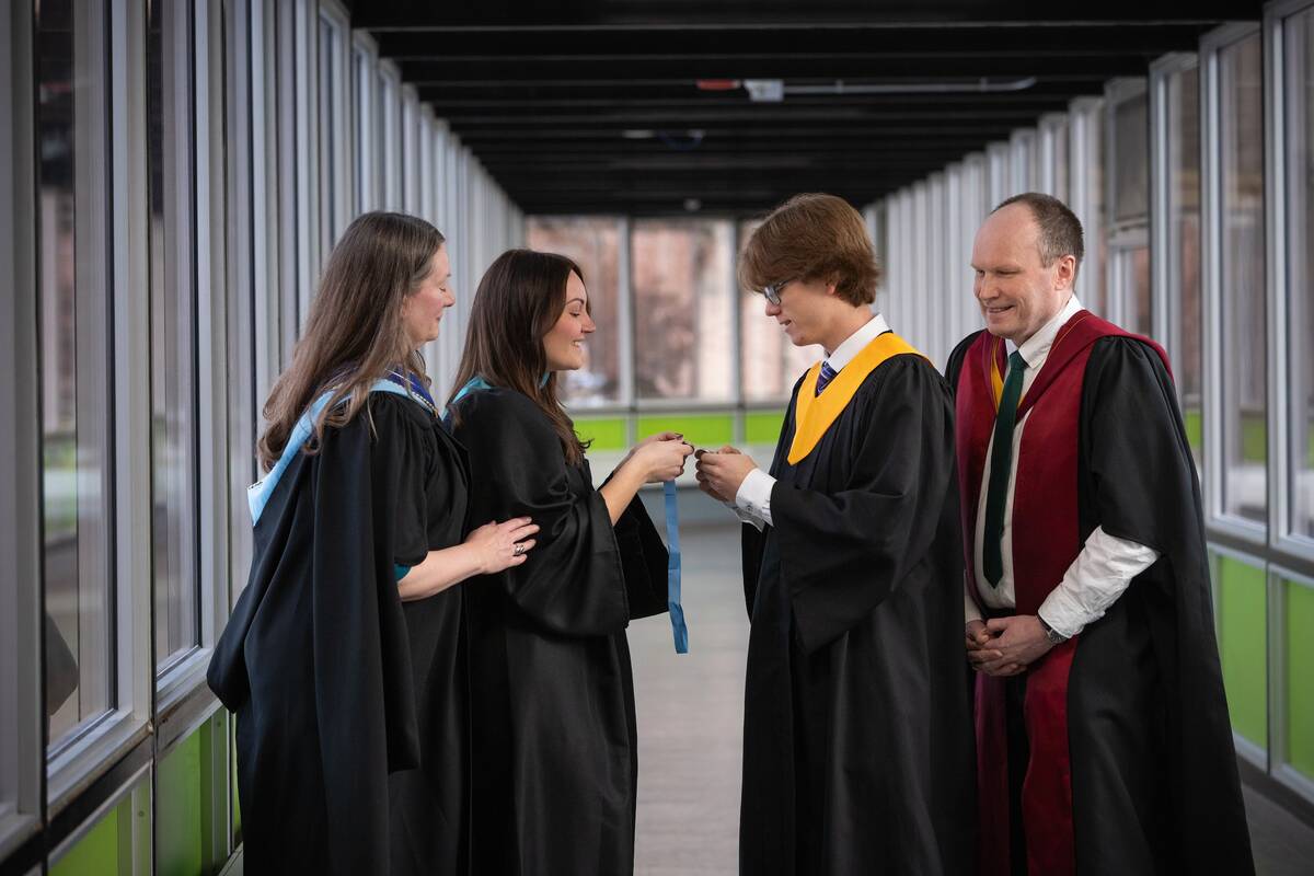 Paul Skretting stands with Lethbridge Polytechnic faculty and administrators in graduation attire. His instructor Kristy Vavra praised his work ethic and passion for agriculture. Photo: Courtesy of Lethbridge Polytechnic