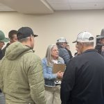 Reeve Tamara Miyanaga stands surrounded by agricultural producers and ratepayers at a public consultation session. The M.D. of Taber has finalized new grazing lease policies after years of heated debate. Photo: Greg Price