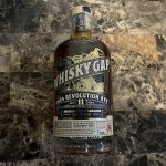 A bottle of Whisky Gap 1924 Revolution Rye, an 11-year-old Alberta-made Canadian whisky, displayed on a dark marble surface. Photo: Greg Price