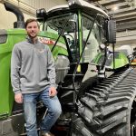 Eric Bossuyt, account manager with AgWest, stands on the steps of a Fendt Vario tractor connected to a Fendt Momentum planter at the dealership in Elie, Man. Photo: Greg Berg