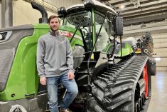 Eric Bossuyt, account manager with AgWest, stands on the steps of a Fendt Vario tractor connected to a Fendt Momentum planter at the dealership in Elie, Man. Photo: Greg Berg